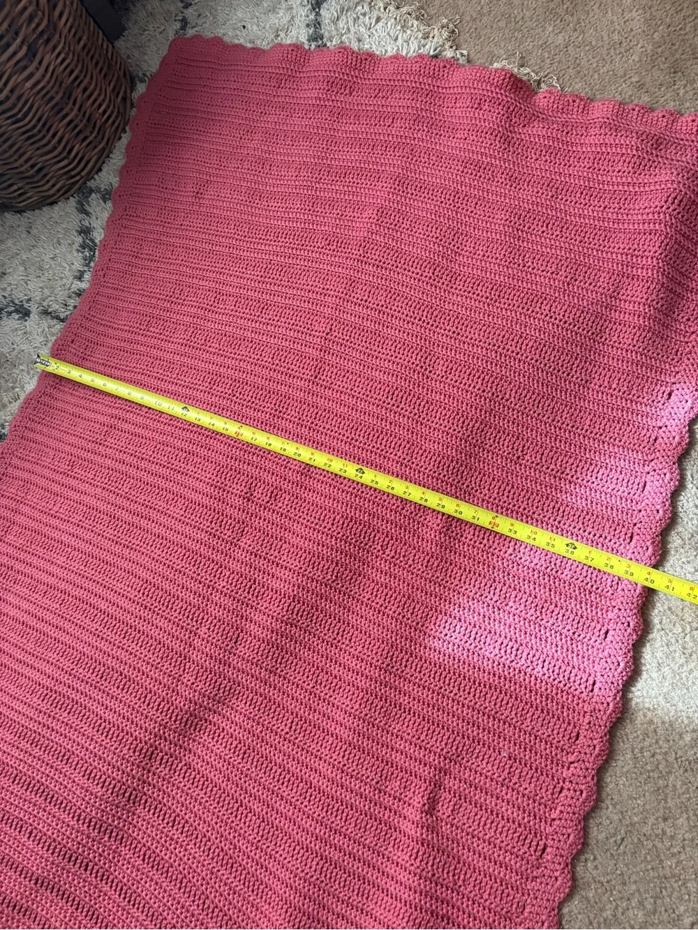 60x40 Handmade pink baby blanket features a scalloped edge and a textured stitch